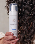 Innersense Organic Beauty I Create Lift Volumizing Foam - model shown holding product next to hair