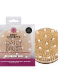 Daily Concepts Daily Detox Massaging Brush showing brush outside with packaging