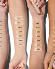 Kosas Cosmetics Revealer Concealer Super Creamy + Brightening Color Chart with color swatches on model arms with various skin tones