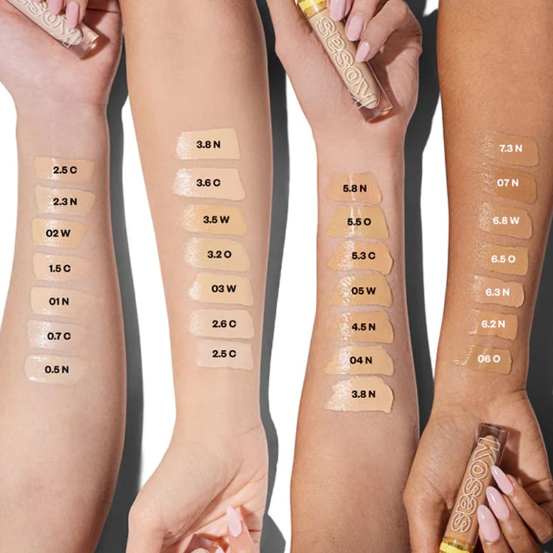 Kosas Cosmetics Revealer Concealer Super Creamy + Brightening Color Chart with color bars on model arms
