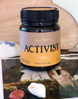 Lifestyle shot of Activist Manuka Surfer's Honey 50+MGO (12 oz)