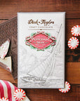 Dick Taylor Craft Chocolate Peppermint Bark White and Dark Chocolate - product shown next to peppermint candies and product packaging