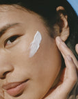 Ursa Major Force Field SPF 30 - Close up of model shown with product smear on face