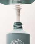 Roz Foundation Conditioner (600 ml Refill) - Product shown being poured into bottle