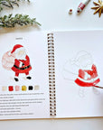 Emily Lex Studio Christmas Watercolor Workbook - model panting inside product