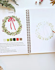 Emily Lex Studio Christmas Watercolor Workbook - model shown painting inside product