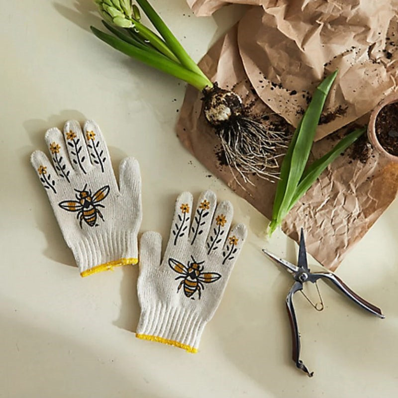 My Little Belleville Bee Gardening Gloves - products shown next to potting supplies and shears 