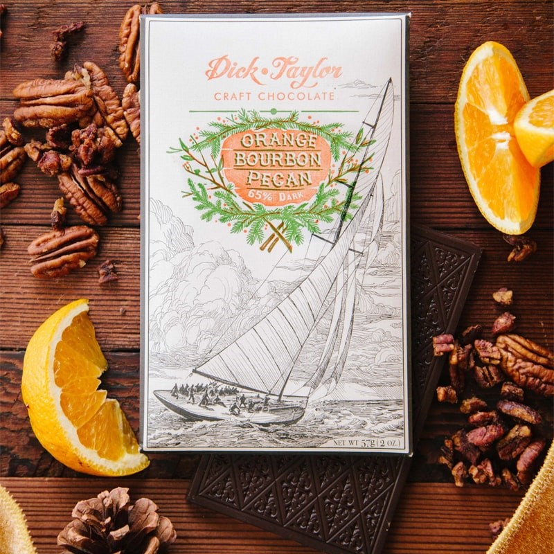 Dick Taylor Craft Chocolate Orange Bourbon Pecan Dark Chocolate - product shown with packaging and ingredients 