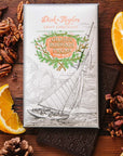 Dick Taylor Craft Chocolate Orange Bourbon Pecan Dark Chocolate - product shown with packaging and ingredients 