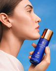 Augustinus Bader The Face Mist - Model shown holding product next to face
