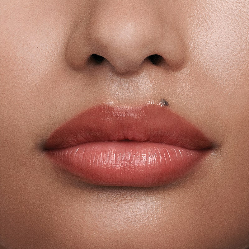 Augustinus Bader The Tinted Lip Balm - Shade 2 - close up of models lips shown wearing product