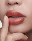 Augustinus Bader The Tinted Lip Balm - Shade 2 - close up of models lips