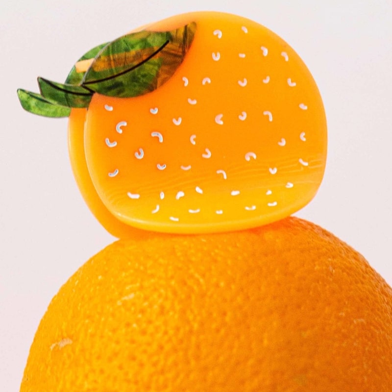 Jenny Lemons Orange Hair Claw - product shown on top of orange