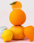 Jenny Lemons Orange Hair Claw - product shown on top of oranges 