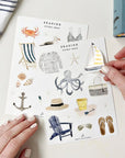 Emily Lex Studio Seaside Sticker Sheet - model shown removing sticker from sticker sheet