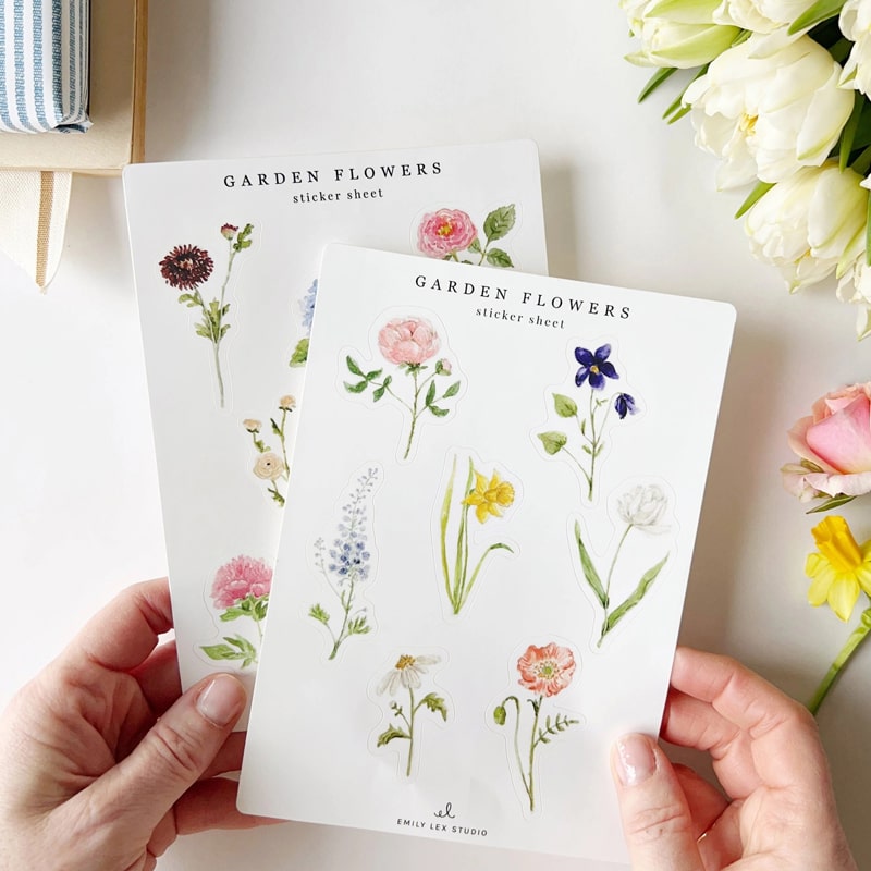 Emily Lex Studio Garden Flowers Sticker Sheet - model holding two sticker sheets with plants near by
