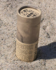 California Naturals Lotion Stick - product shown sticking out of sand