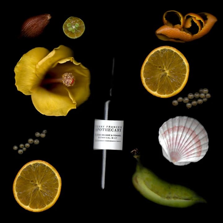 Lifestyle shot of Penny Frances Apothecary Blood Orange & Fennel Botanical Mist (50 ml) with ingredients in the background