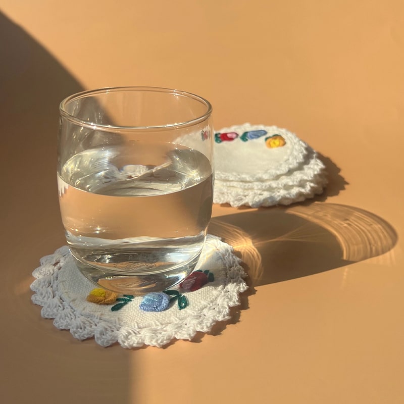 Seak Flower Embroidered Cotton Coasters Set - products shown with glass of water on coaster
