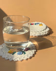 Seak Flower Embroidered Cotton Coasters Set - products shown with glass of water on coaster