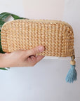 Seak Woven Clutch with Silk Tassel Key Chain - Blue - model shown holding product in front of purse