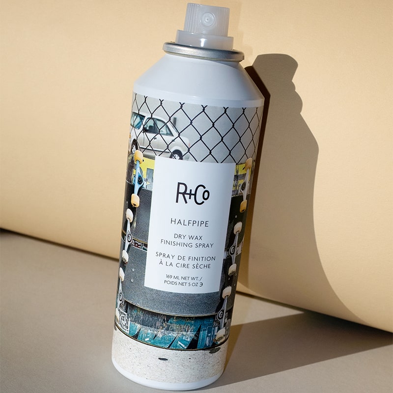 R+Co Halfpipe Dry Wax Finishing Spray - product shown leaning against paper