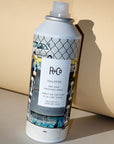 R+Co Halfpipe Dry Wax Finishing Spray - product shown leaning against paper