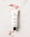 Essential Parfums Hand Cream - Rose Magnetic - product on top of fragrance ingredients