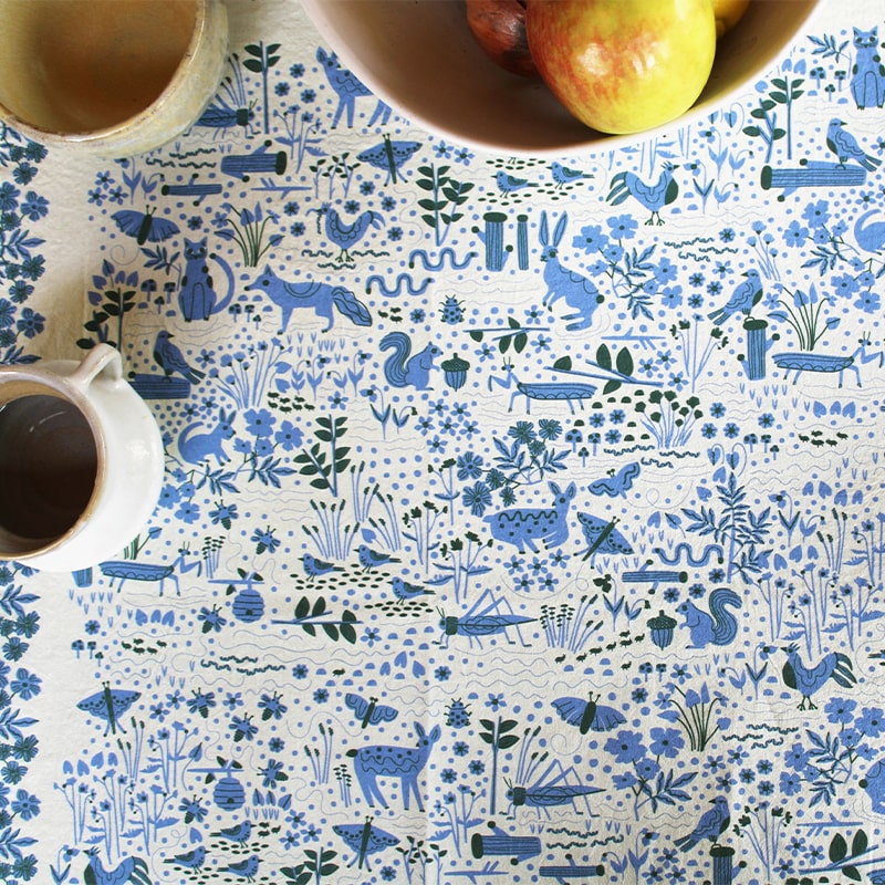 Leah Duncan Garden Friends Art Tea Towel - product shown under fruit bowl and coffee cups