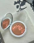 Flyte.70 ColorBack.Burnished Bronze All-in-One Makeup Palette - Vacation - lifestyle photo of product on stone slab