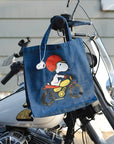 Three Potato Four 3P4 X Peanuts Vintage Market Tote - Snoopy Easy Rider - product shown hanging from motorcycle bars