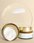 Oliflora L'immortelle Creme - product shown with open cap and closed cap with a texture swatch on glass plate