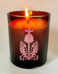 The Quiet Botanist Orchard Sun Scented Candle - product shown with lit wick