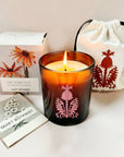 The Quiet Botanist Orchard Sun Scented Candle - product contents shown, candle, cotton bag, matchbook, and packaging 