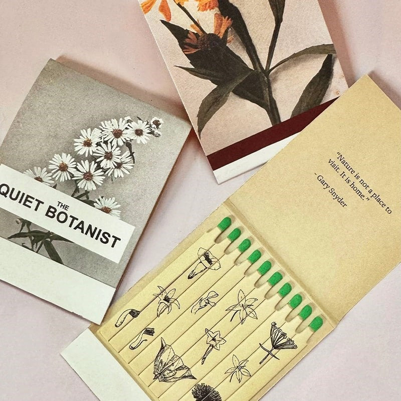 The Quiet Botanist Forever Flowers Scented Candle - product matchbooks opened and closed shown