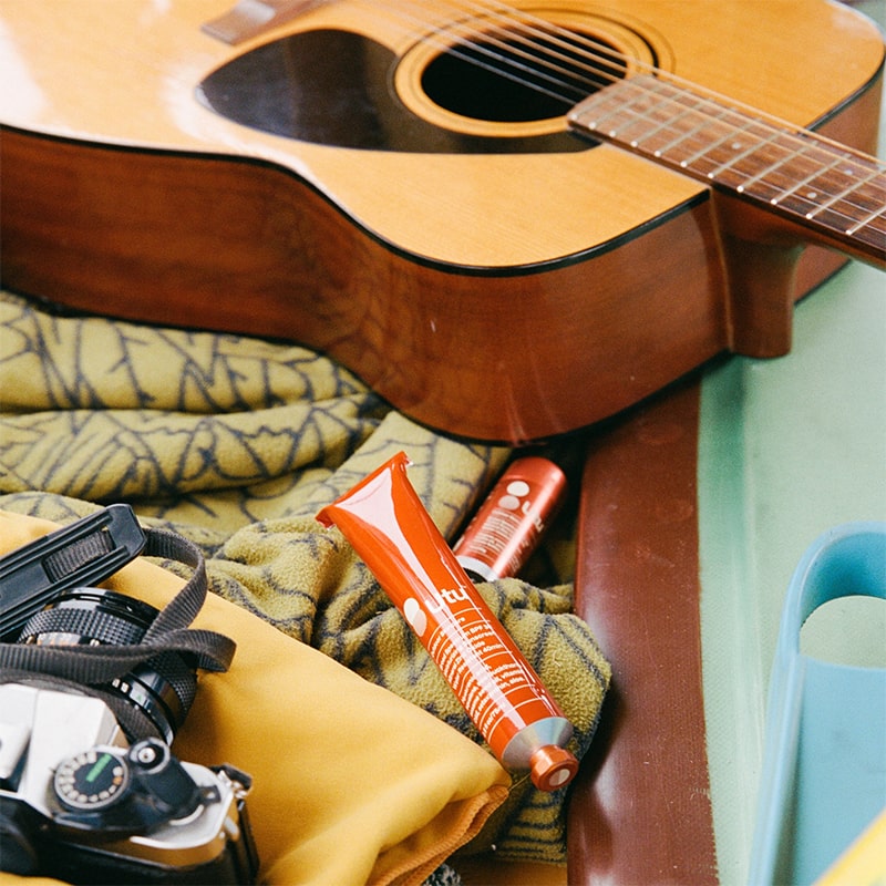 Moisturizing Mineral Sunscreen Lotion SPF 30 - product shown next to guitar and camera