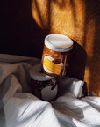 Sqirl Yuzu Passionfruit Fruit Spread - two products stacked on blanket