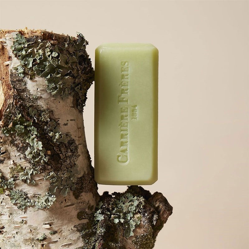 Carriere Freres Solid Body Soap - Bosci - product shown on wood piece with moss