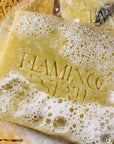 Flamingo Estate Organics Lemon & Hawaiian Turmeric Soap Brick - product shown with soap bubbles 