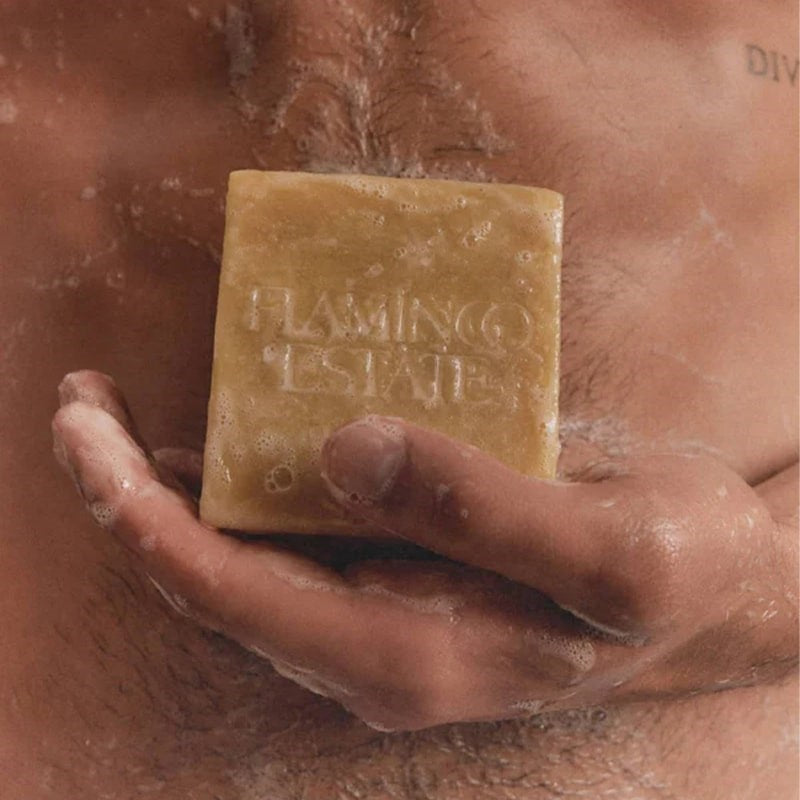 Flamingo Estate Organics Lemon & Hawaiian Turmeric Soap Brick - model shown holding product