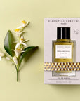 Lifestyle shot top view of Essential Parfums Neroli Botanica By Anne Flipo (100 ml) in box with Neroli flowers next to the box