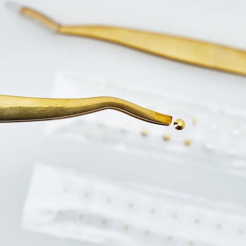 WTHN Gold Ear Seed Kit - Acupressure Accessory - close up of tweezers