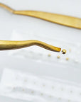 WTHN Gold Ear Seed Kit - Acupressure Accessory - close up of tweezers