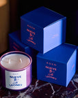 ROEN Candles Nueve Leones Scented Candle - product shown next to packaging