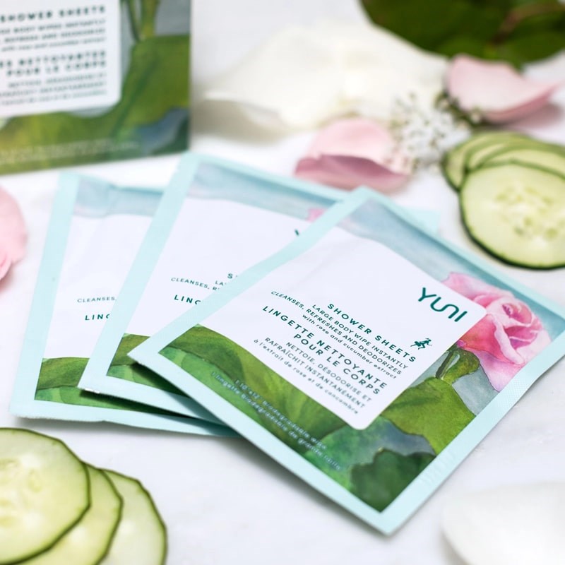 YUNI Beauty Yuni Rose Cucumber Shower Sheets Large Body Wipes - products shown next to sliced cucumber