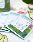 YUNI Beauty Yuni Rose Cucumber Shower Sheets Large Body Wipes - products shown next to sliced cucumber