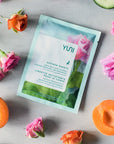 YUNI Beauty Yuni Rose Cucumber Shower Sheets Large Body Wipes - product next to flowers and fruit 