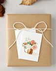 Emily Lex Studio Dahlia Mini Notecard - product on top of present next to leaves