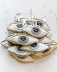 Skippy Cotton Evil Eye - Lavender Scented Token - multiple products stacked in pile