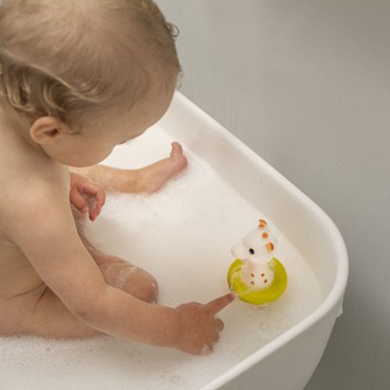 Sophie la Girafe Bath Toy - product shown in bathtub with baby